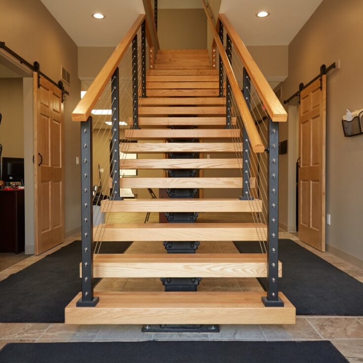 Floating Stair with Cable Railing and a Graspable Wood Handrail