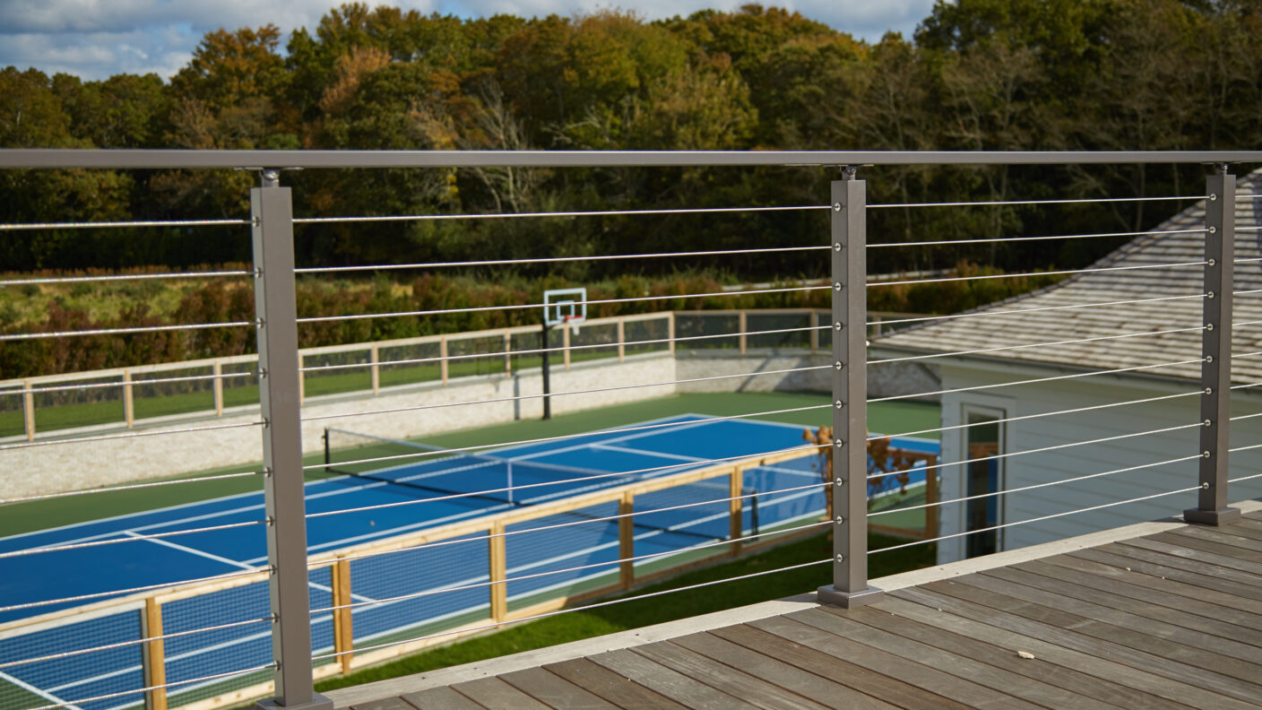 Grey Cable Railing posts and handrail on deck