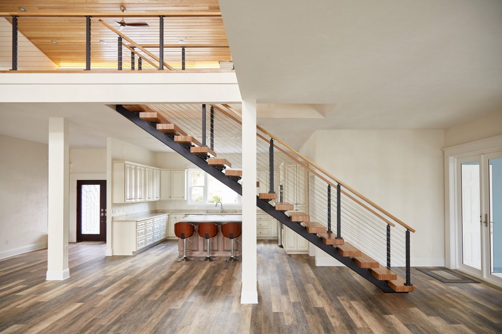 Metal floating Stair Stringer with white oak stair treads from the side