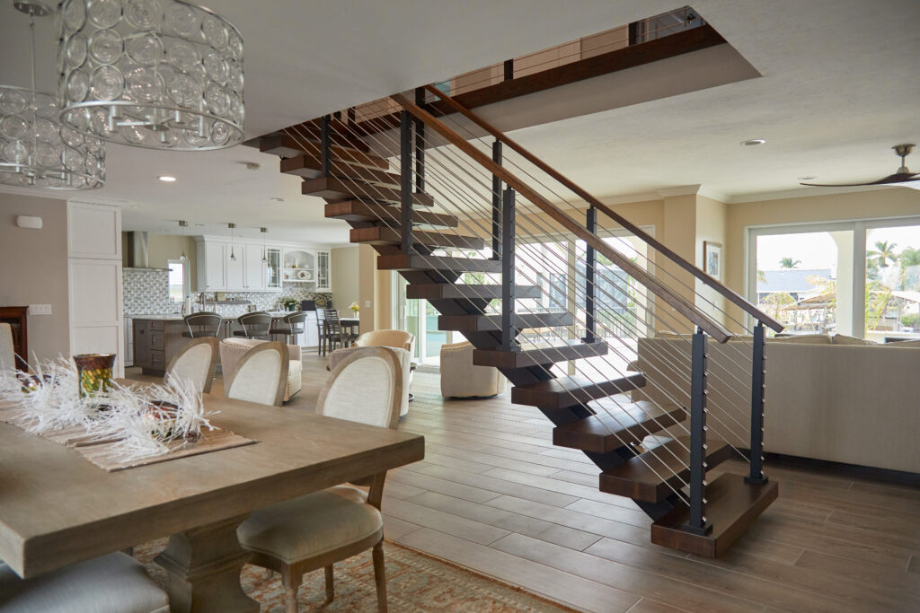 Straight Prefab Stairs in an open concept home feature white oak treads and rod railing.