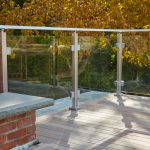 Glass railing post and glass railing clip