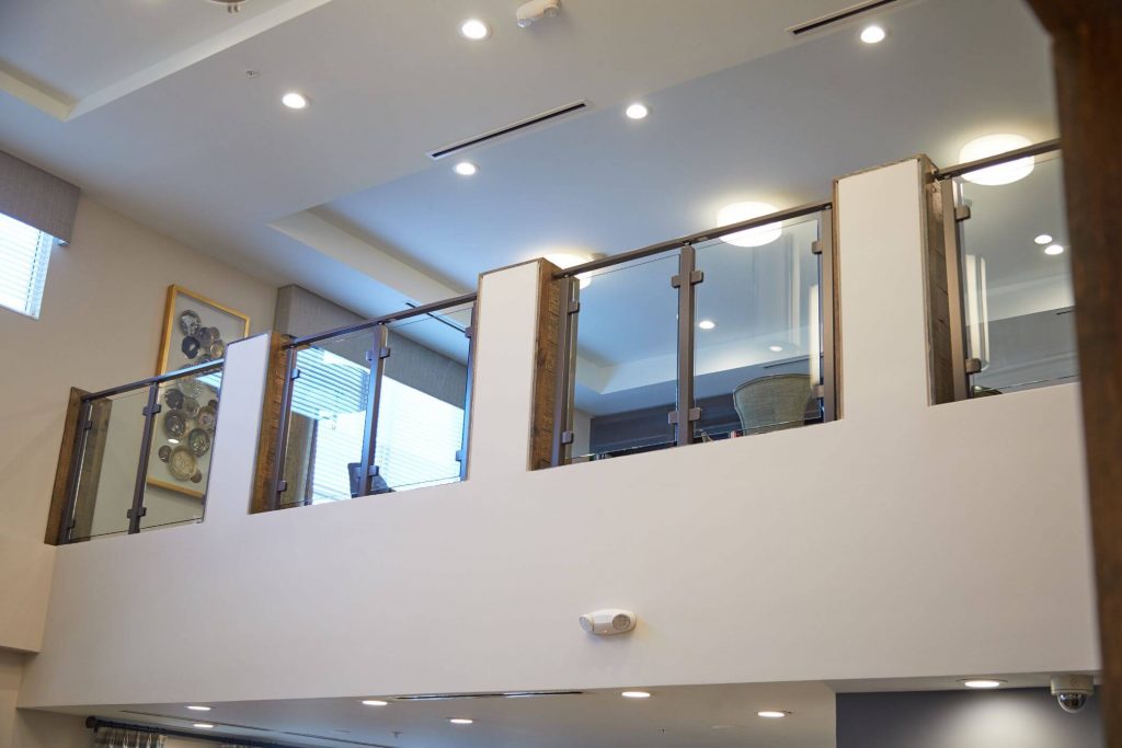 Glass railing with stainless steel posts