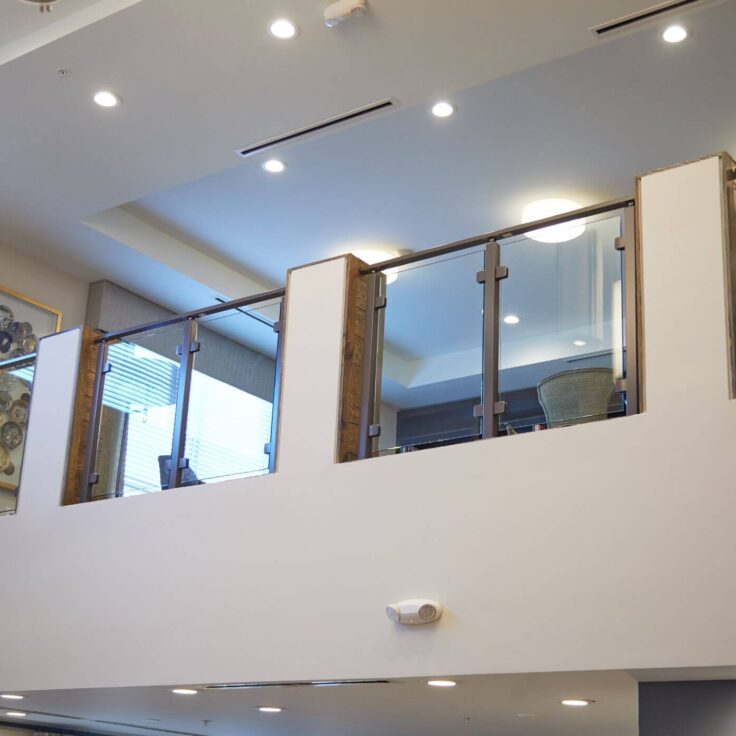 Glass railing with stainless steel posts