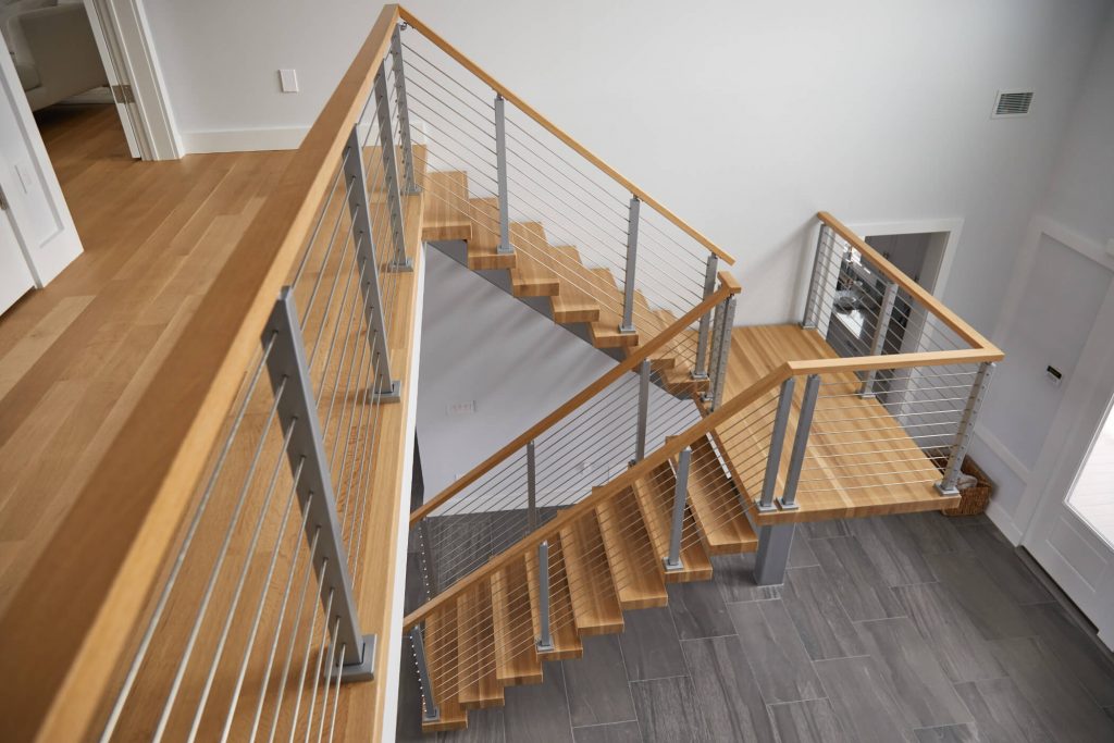 Floating stairs for indoors with rod railing
