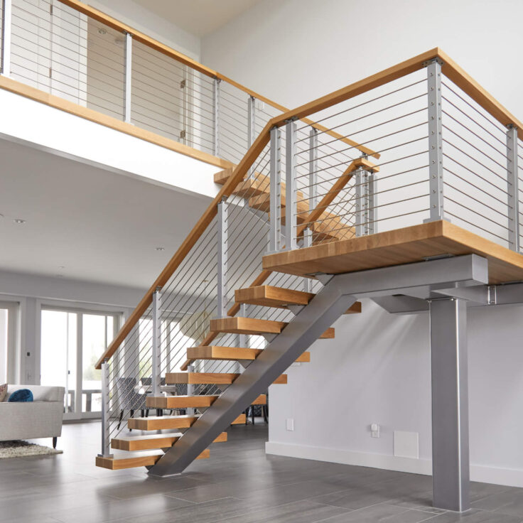 Floating stair treads with wooden handrail