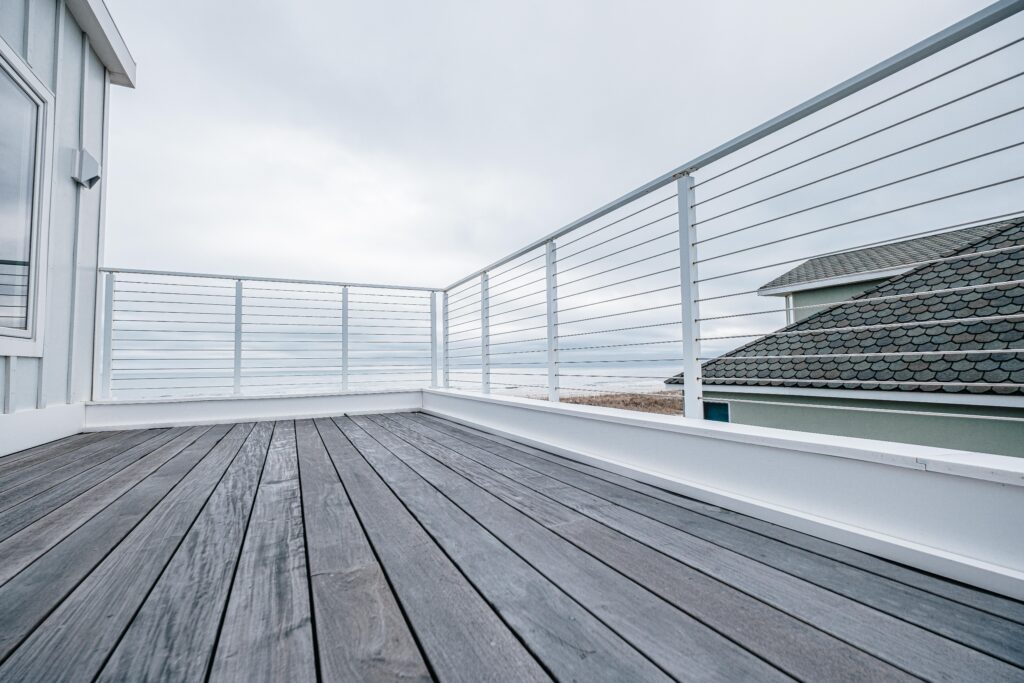 White cable deck railing on a coastal balcony
