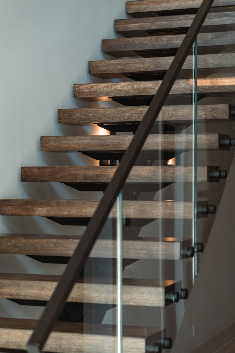 Dark Stained Wooden Stair Treads with Black Metal Stringer