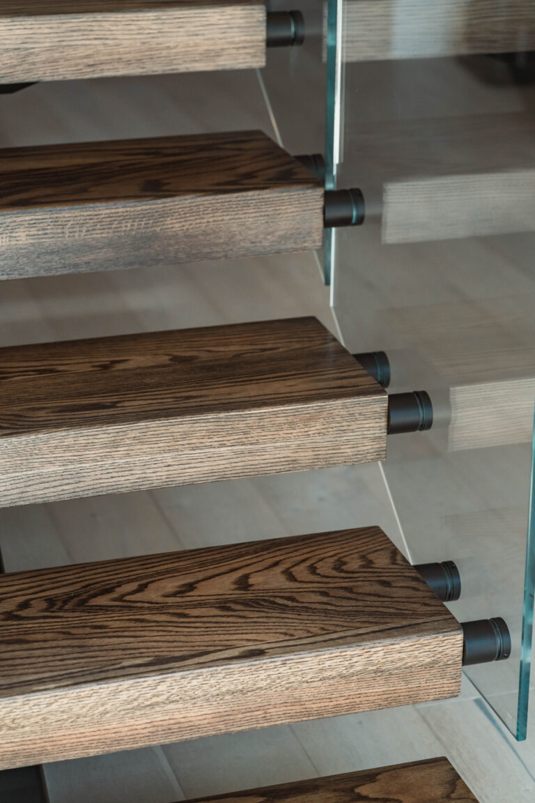 Dark Stained Wooden Stair Treads with Black Metal Stringer
