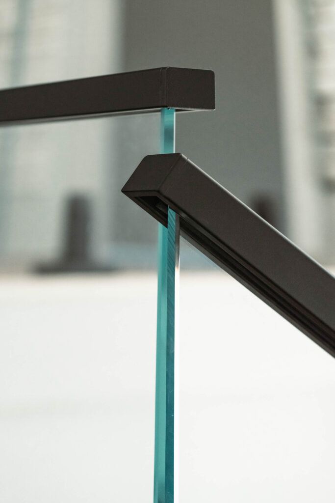 Glass Railing with Black Metal Handrail