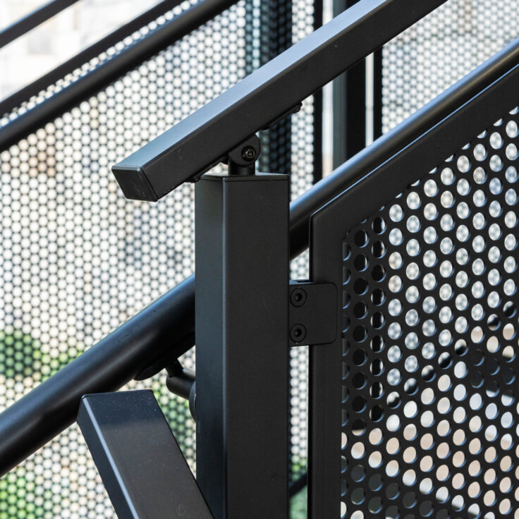 Floating Stairs made from Porcelain Treads and Perforated Railing Panels