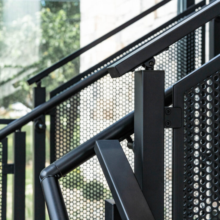 Floating Stairs made from Porcelain Treads and Perforated Railing Panels