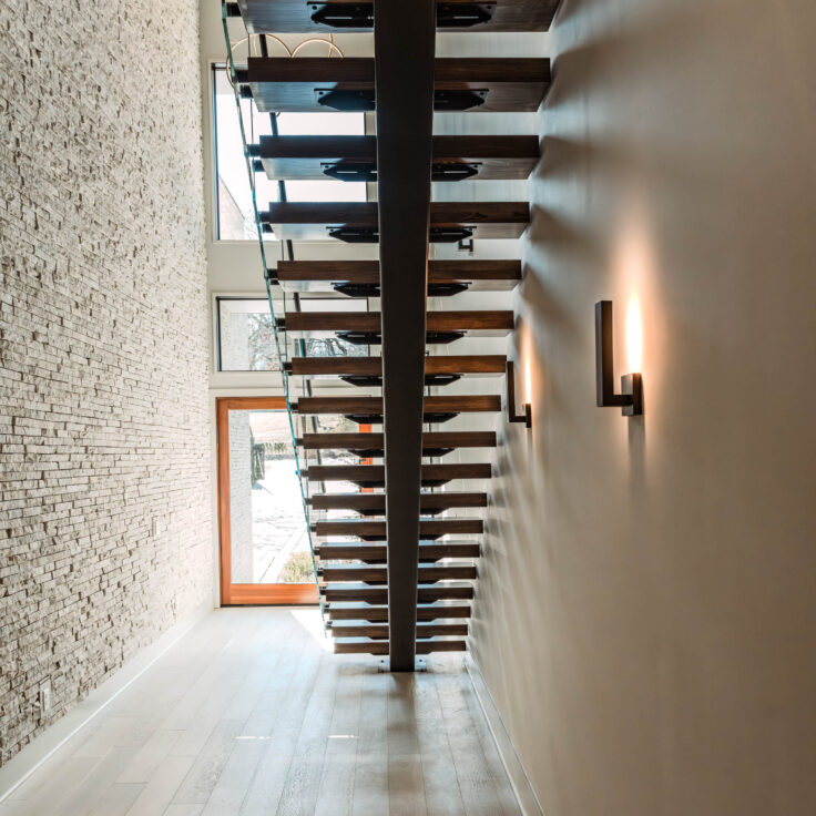 Dark Stained Wooden Stair Treads with Black Metal Stringer