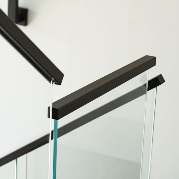 Glass Railing with Black Metal Handrail