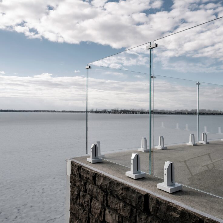 Glass Railing with Icy White Accents on a Frozen Lake