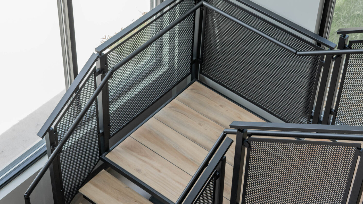 Floating Stairs made from Porcelain Treads and Perforated Railing Panels