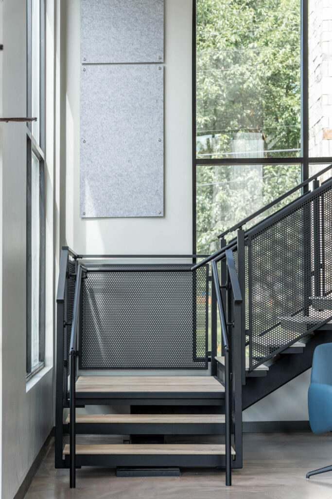 Floating Stairs made from Porcelain Treads and Perforated Railing Panels